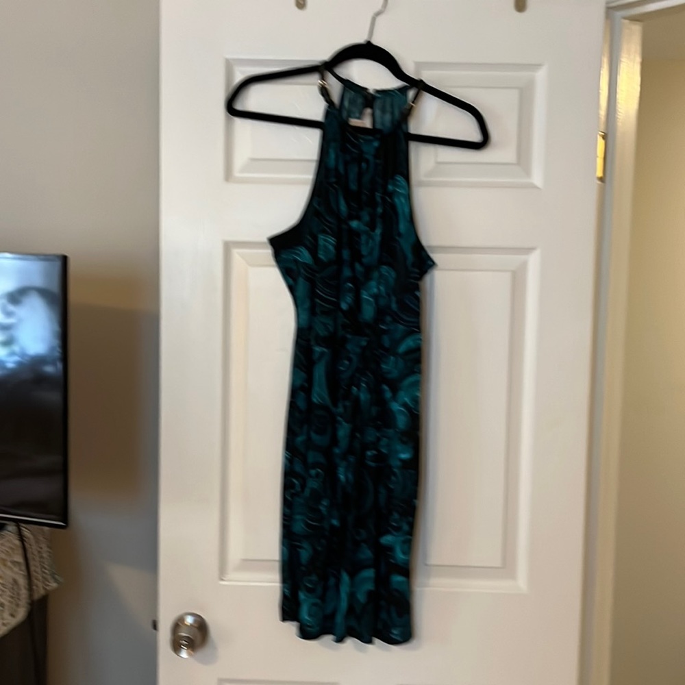 Beautiful Kors dress with wrap front. Very flattering when on. Great colors